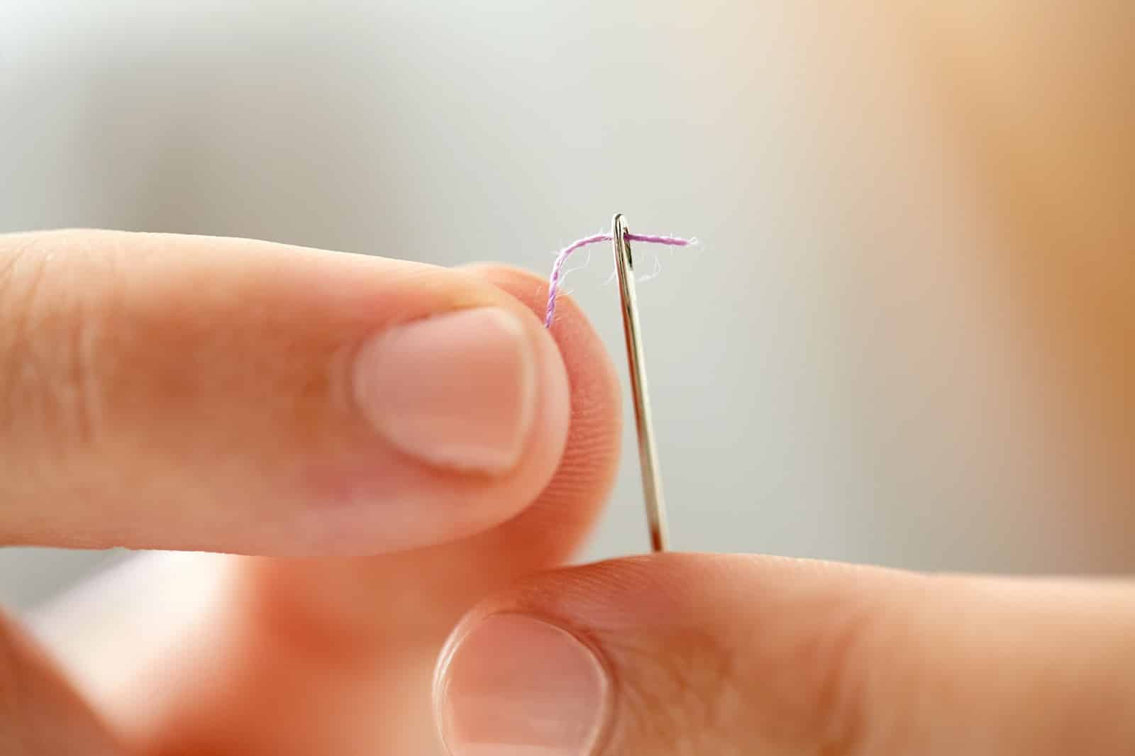 https://marshalldrygoods.com/wp-content/uploads/2024/08/hands-of-tailor-woman-threading-needle-PPHSE6U.jpg