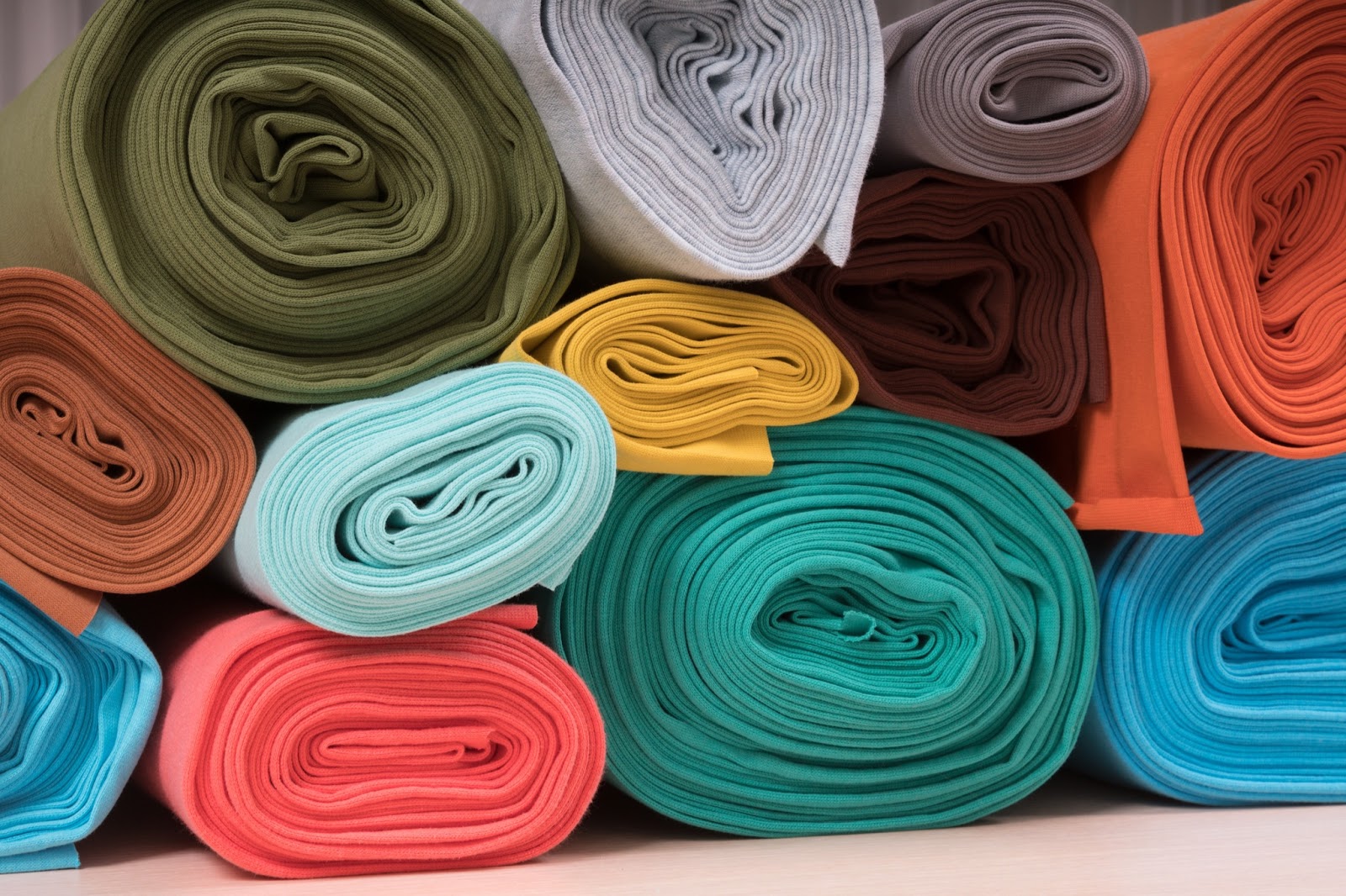 https://marshalldrygoods.com/wp-content/uploads/2024/09/rolls-of-knitted-fabric-in-assortment-2021-08-26-17-37-41-utc.jpg