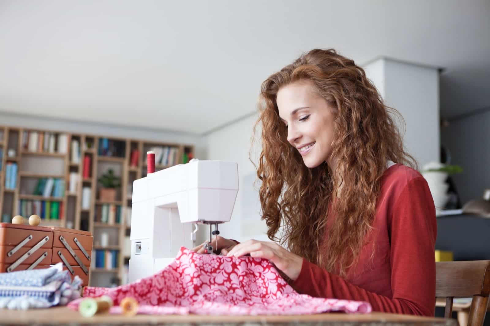 https://marshalldrygoods.com/wp-content/uploads/2024/09/smiling-woman-at-home-using-sewing-machine-2022-12-16-22-46-44-utc.jpg