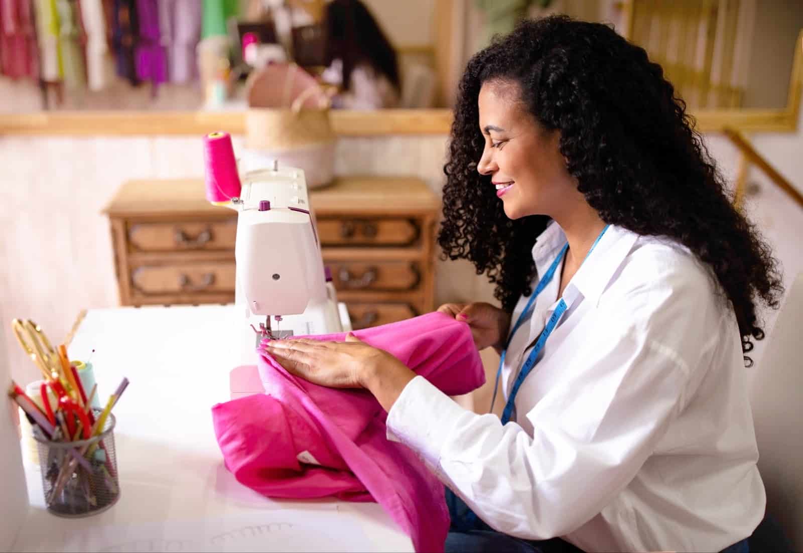 https://marshalldrygoods.com/wp-content/uploads/2024/10/side-view-of-middle-eastern-tailor-lady-sewing-gar-2023-11-27-05-03-11-utc.jpg