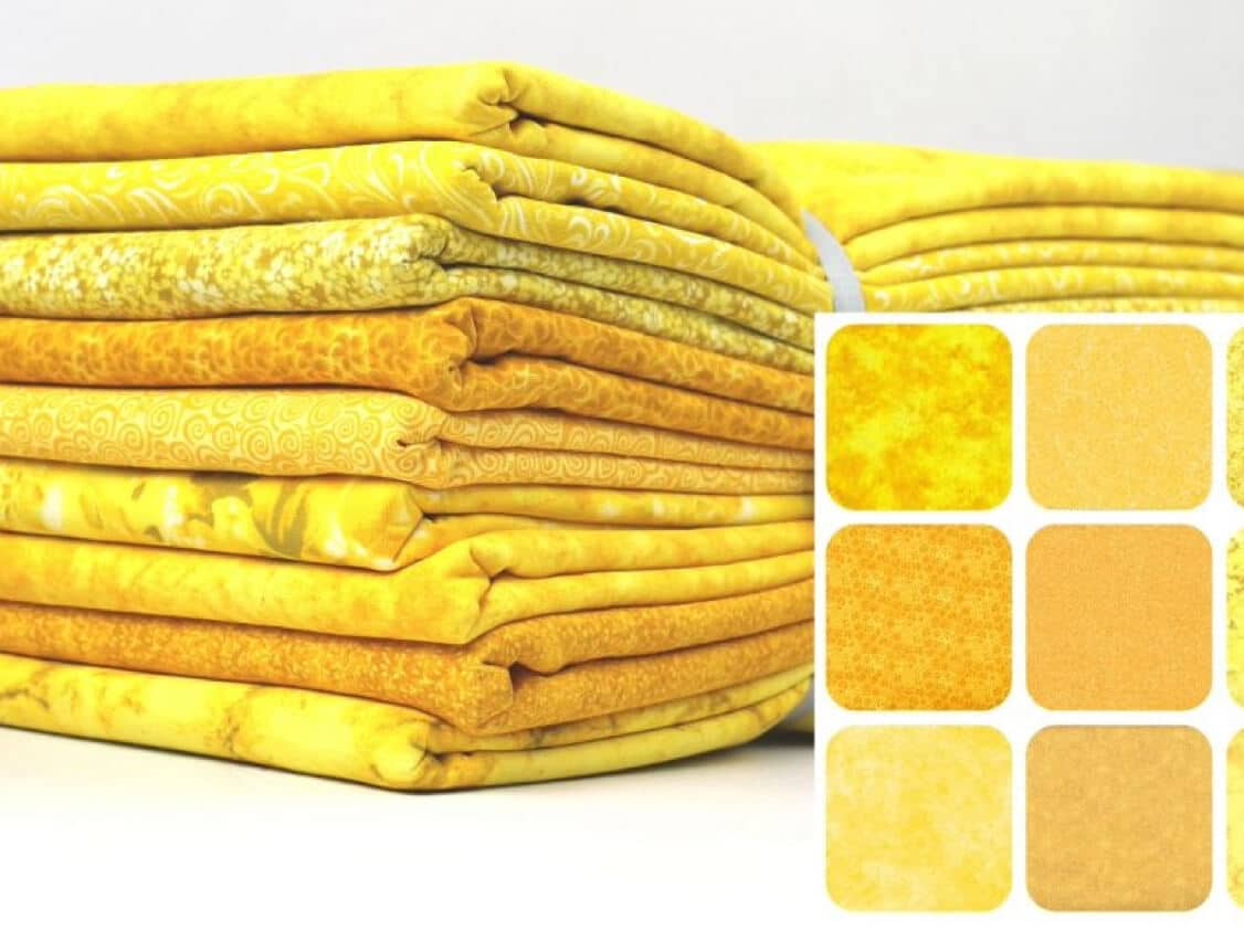 Bundle of sunny yellow fat quarters in assorted tonal and small-scale prints for quiltmaking.