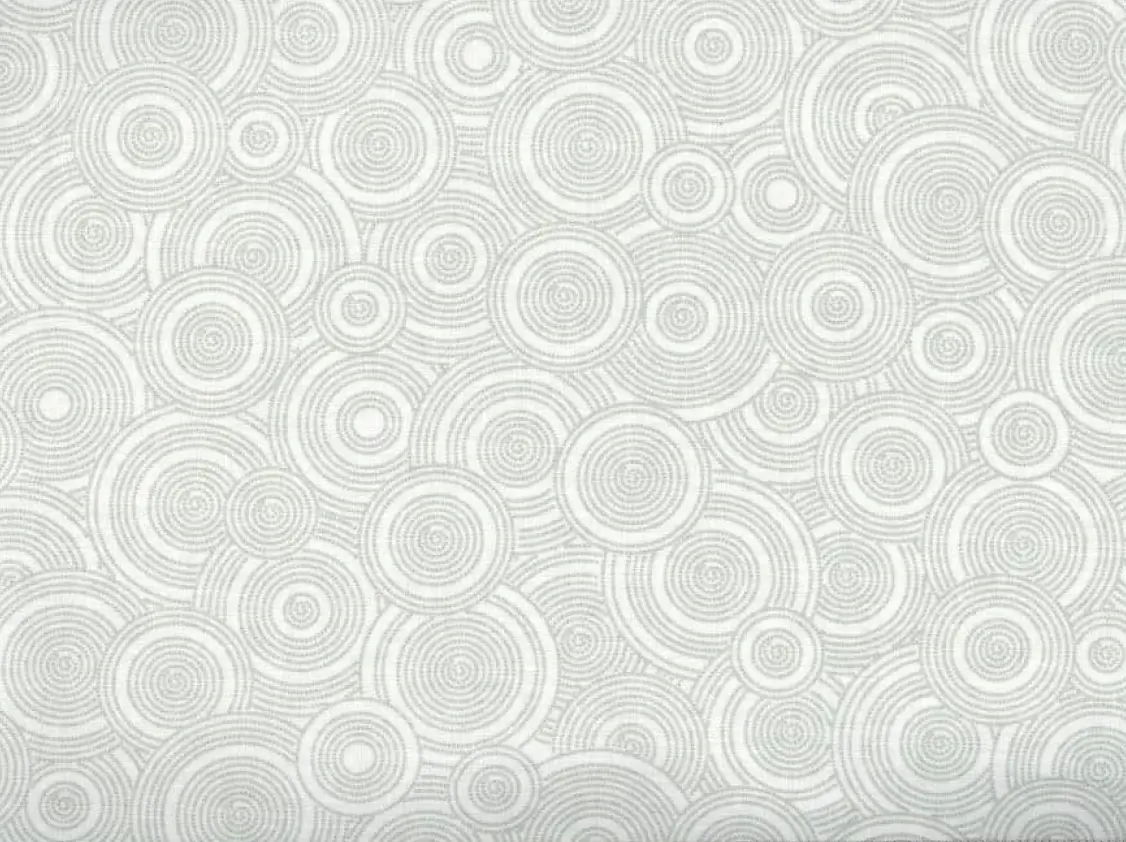 Gray cotton fabric with circular designs.