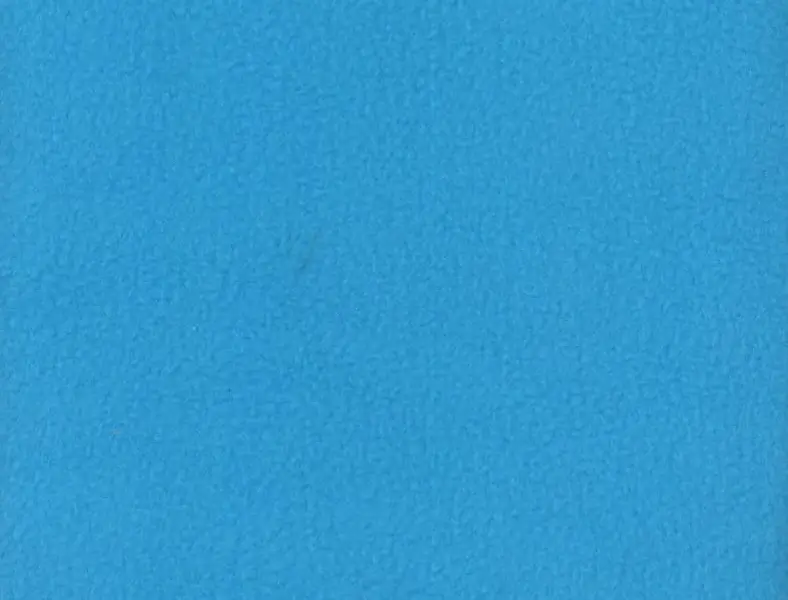 Close-up texture of solid turquoise blue fleece fabric